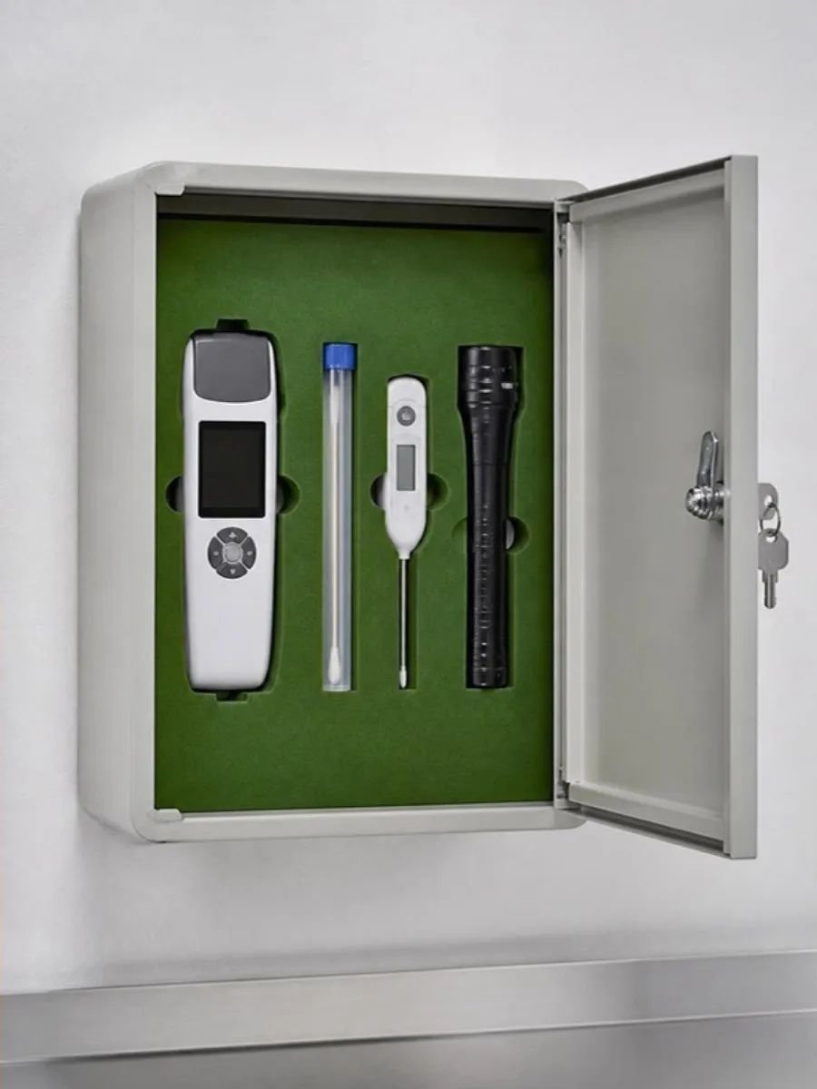 Lockable wall cabinet with a shadow board holding an ATP meter, thermometer and flashlight